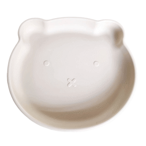 Plato de silicona infantil en forma de oso color beige con base de succión.