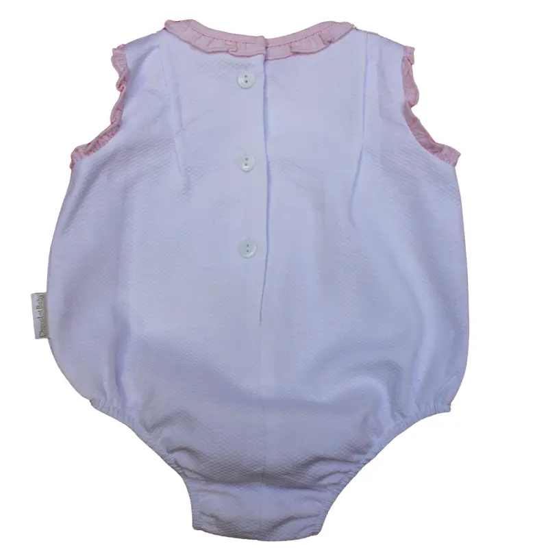 Enterizo plisado de color blanco con volantes rosas para bebé de Chocolat Baby