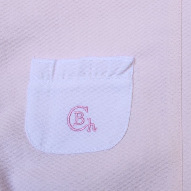 Mono bebé rosa y blanco Chocolat Baby detalle del bolsillo trasero.